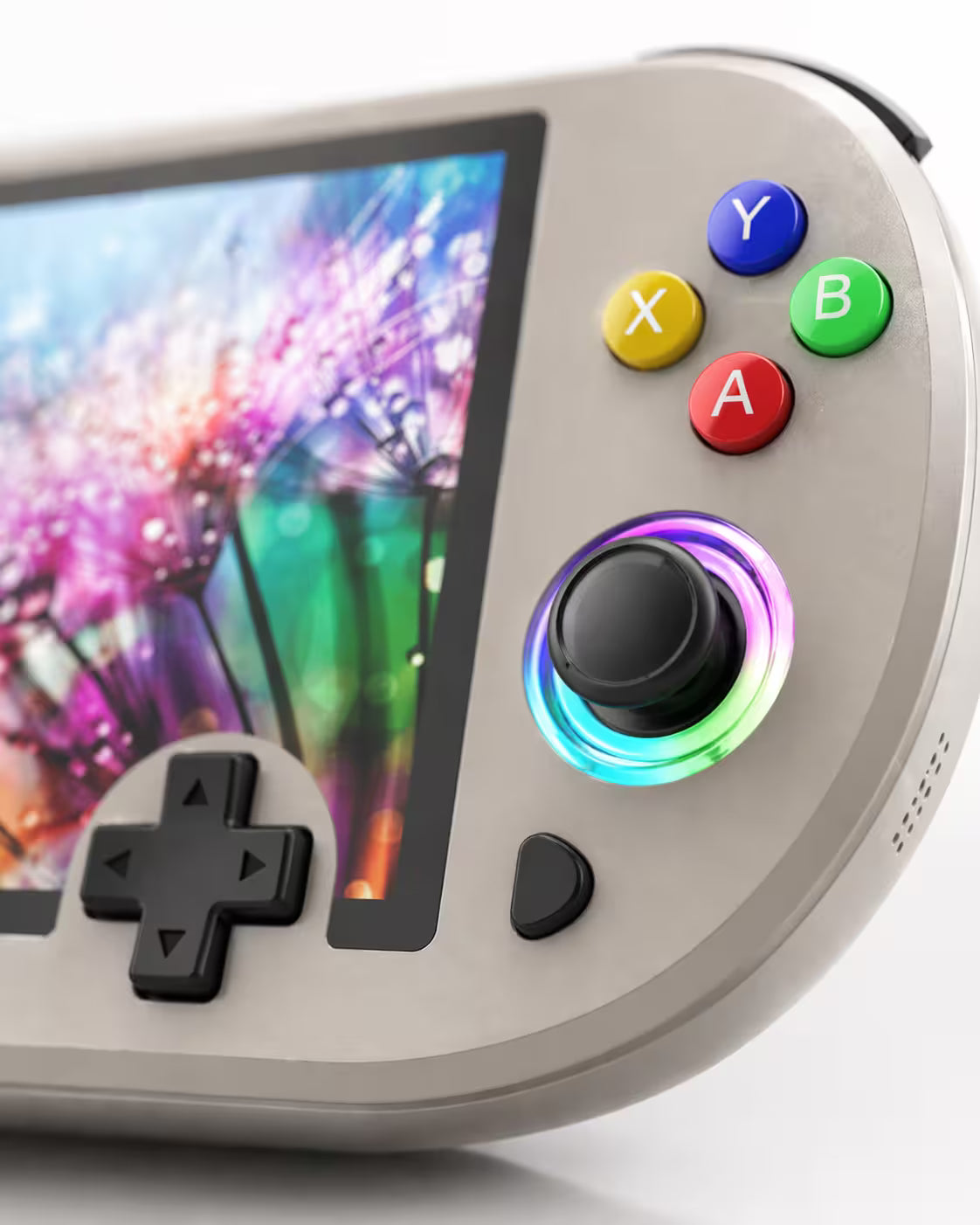 Close-up of the iGameConsole M22 Pro warm gray handheld console showing colorful ABXY buttons, RGB-ring joystick, black D-pad, screen edge, speaker holes, and rounded shell details.