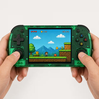 Adult hands holding the iGameConsole R36H Promax transparent green portable handheld console, showing its compact horizontal design, dual joysticks, black D-pad, colorful ABXY buttons, and retro pixel platform game screen.