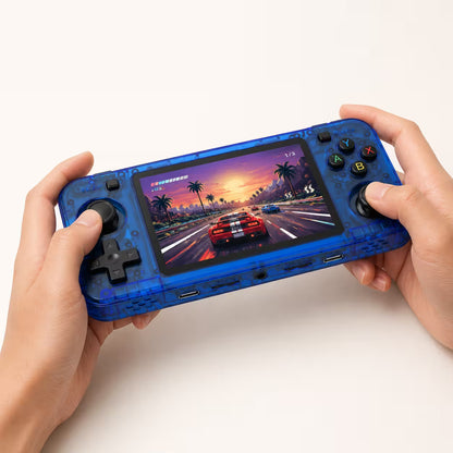 Adult hands holding the iGameConsole R36H transparent blue portable handheld console, showing its horizontal shape, black D-pad, dual analog sticks, ABXY buttons, and racing game display.