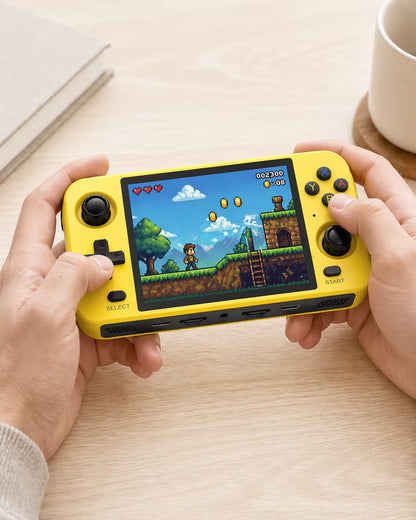Adult hands holding the iGameConsole R40S bright yellow portable handheld console, showing its compact horizontal design, dual joysticks, D-pad, colorful ABXY buttons, and retro platform game screen.