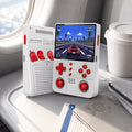 iGameConsole R40XX Pro Max white and red portable gaming console on an airplane tray table with a takeaway coffee cup, passport, and travel pouch, showing retro gaming on the go.