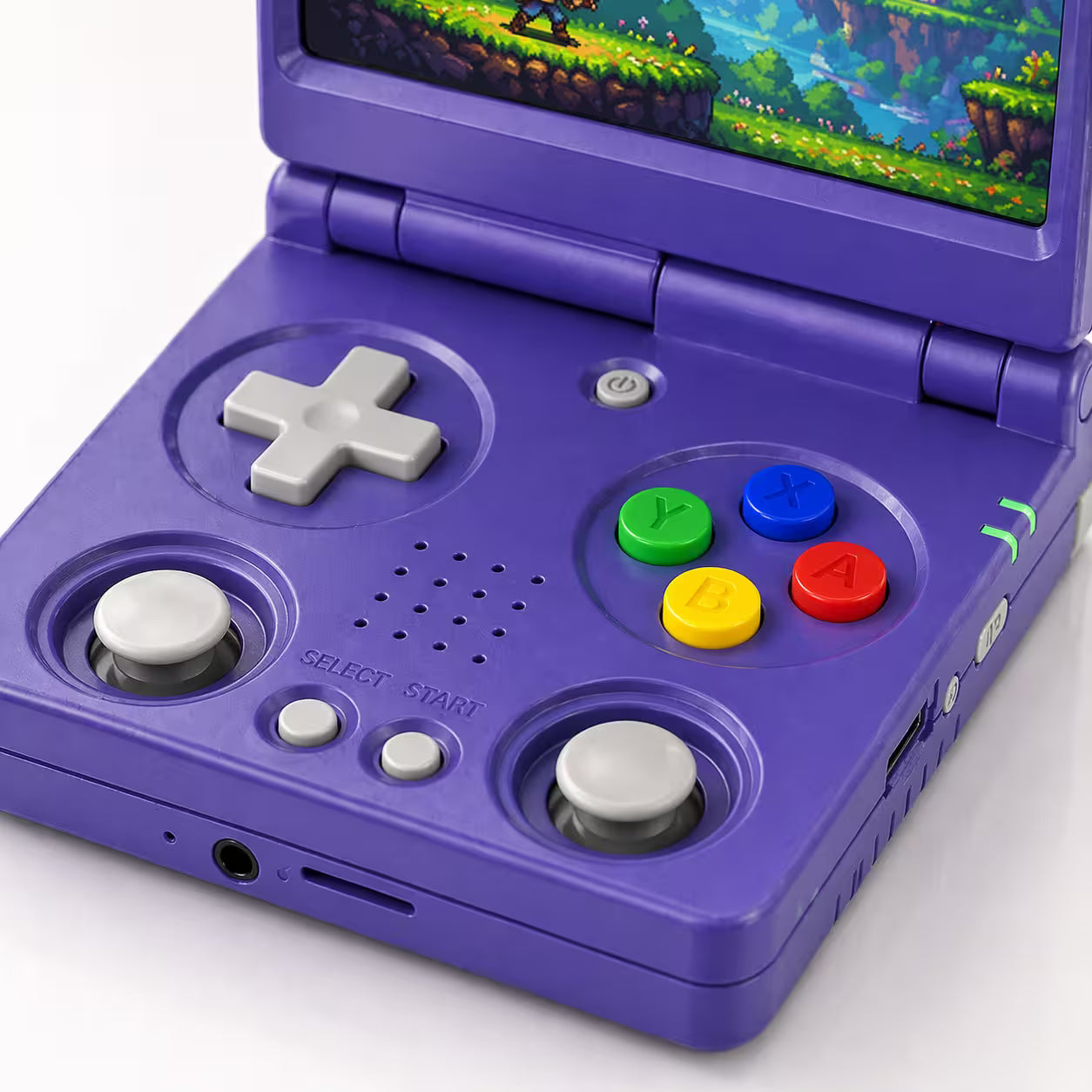 Close-up of the iGameConsole RG34XXSP Foldable Pro purple retro handheld console showing dual joysticks, D-pad, colorful ABXY buttons, speaker holes, front ports, and foldable hinge details.