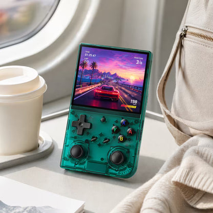 iGameConsole RG35XX Pro transparent teal portable gaming console on an airplane tray table with a coffee cup and travel bag, showing retro gaming on the go.