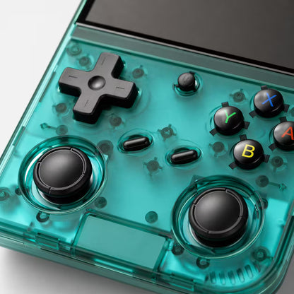 Close-up of the iGameConsole RG35XX Pro transparent teal retro handheld console showing dual joysticks, D-pad, ABXY buttons, front controls, screen edge, and translucent shell details.
