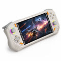 iGameConsole RG52 Pro Max off-white and orange handheld game console with a horizontal design, dual RGB-ring joysticks, gray D-pad, light gray ABXY buttons, and a vivid action game screen on a clean white background.