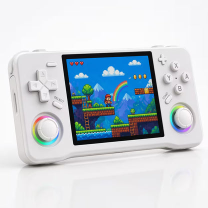 iGameConsole XF35H white handheld game console with a square display, dual RGB-ring joysticks, D-pad, ABXY buttons, and a colorful retro pixel game screen on a clean white background.