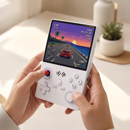 iGameConsole XF40V white portable handheld console held in adult hands, showing the red joystick, white controls, RGB ring accents, and retro racing game screen.