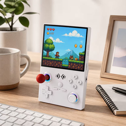 iGameConsole XF40V white retro portable gaming console on a clean modern desk setup with a plant, coffee mug, notebook, keyboard, and colorful pixel game screen.